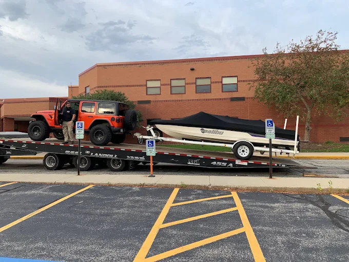 Luxury vehicle transported on a tow truck